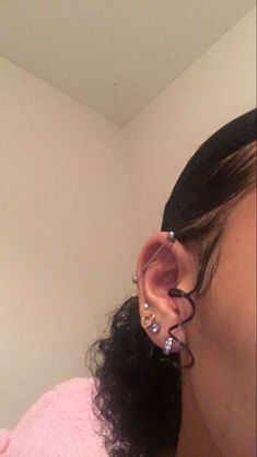 a woman with ear piercings on her ears