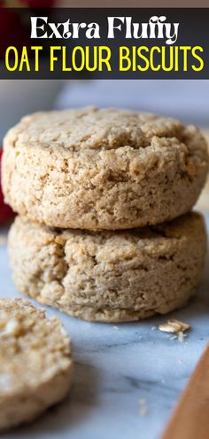 three oat flour cookies stacked on top of each other with text overlay reading extra fluffy oat flour biscuits