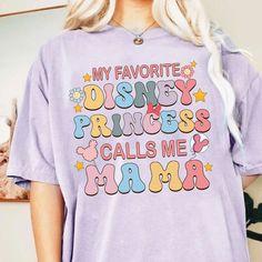 a woman wearing a purple tshirt that says my favorite disney princess calls me mama