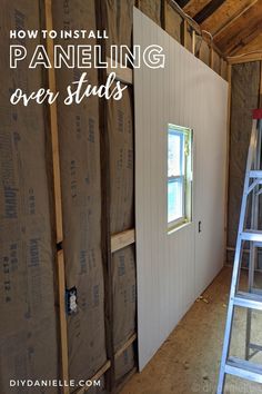 the inside of a house being built with walls and ladders in place to install paneling