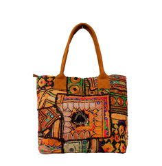 This bohemian banjara bag is the perfect accessory for the bohemian fashionistas. Key Features: Hand made in India. Fair trade guaranteed. Zipper top. Inside zipper pocket. Size ( Approx ) Height - 12 Inches/30 Cm. Width - 15 Inches/38 Cm. Handle Length 10 inches/ 25 Cm.  Inside Pocket - 3 ( As you can see in the picture ) Zipper Pocket - 1 Made from vintage Banjara  mirror work embroidery, it's a strong bag, and the perfect size for all your essential everyday stuff and more.... You'll get a lo Embroidered Brown Hobo Tote Bag, Embroidered Brown Tote Hobo Bag, Embroidered Brown Hobo Bag, Bohemian Style Multicolor Shopping Bag, Hippie Brown Shoulder Bag, Bohemian Tote Bag For Shopping, Bohemian Multicolor Bags With Leather Handles, Bohemian Multicolor Bags For Daily Use, Multicolor Bohemian Bags For Daily Use