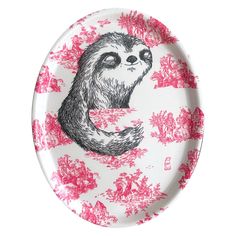 a plate with a drawing of a slotty on it's side and pink flowers around the edge