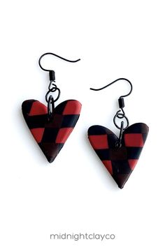 Red and black buffalo plaid polymer clay earrings. Heart shaped dangle earrings. Bold and unique minimalist style earrings make the perfect accessory for an valentines day outfit. Give as a unique birthday gift for grandma, teacher, or sister. Makes a great winter or spring birthday gift! Shop these trendy handmade earrings for women in my etsy shop! Black Polymer Clay Jewelry Gift, Black Polymer Clay Jewelry With Ear Wire, Black Earrings For Valentine's Day, Black Polymer Clay Earrings With Ear Wire, Plaid Polymer Clay, Black Valentine's Day Earrings, Red And Black Clay Earrings, Red Hypoallergenic Polymer Clay Jewelry, Handmade Red Polymer Clay Earrings