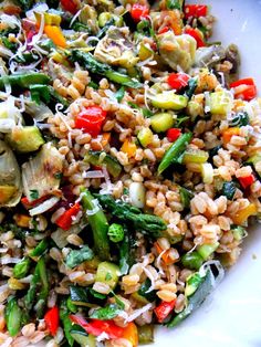 a white bowl filled with rice and vegetables