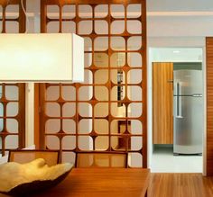 a modern kitchen with wood paneling and stainless steel appliances in the back ground area