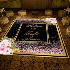 a wedding carpet with pink flowers on it in the middle of a room filled with tables and chairs