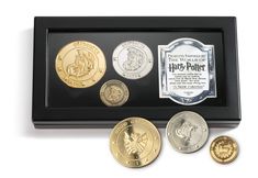 the harry potter coin collection is displayed in a black case