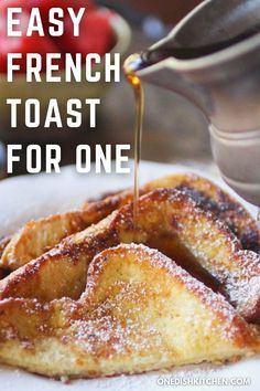 french toast with syrup being drizzled over it on a white plate and the words, easy french toast for one