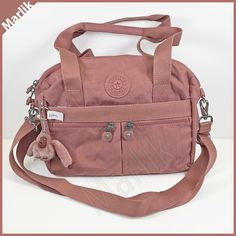 Kipling Klara HB7697 Women's Cross body Satchel Bag, Kind Rose/Pink Approx. measurements : 11 x 10 x 5" One big main compartment, 3 pockets inside ( one zipped ), One Pen Pocket One large front Pocket, 2 smaller front pockets ( zipped ), One large back Pocket With Monkey Keychain Brand New Original Kipling Bag See other KIPLING items. Images, text description, graphics, and layout format, copyright Marlik. Pink Pouch Shoulder Bag With Pockets, Pink Satchel Bag With Pockets, Pink Shoulder Bag With Pockets For On-the-go, Pink Satchel Shoulder Bag With Pockets, Pink Shoulder Satchel With Pockets, Pink Rectangular Satchel With Pockets, Pink Tote Satchel With Pockets, Travel Pink Satchel With Pockets, Everyday Pink Satchel With Pockets