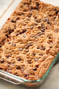 a glass baking dish filled with cookies and chocolate chips