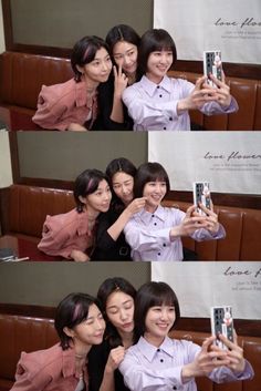 three women taking pictures with their cell phones in front of them, and one woman holding up her phone