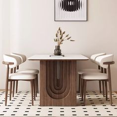 a dining room table with four chairs and a vase on the top, in front of a white wall