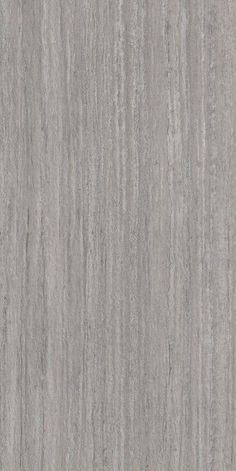 a close up view of the surface of a grey marble wallpaper with vertical stripes