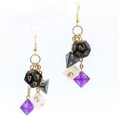 Asexual pride flag colors in an awesome pair of miniature dice earrings! If you've been eyeing our full-size dice earrings but haven't bought them because of the weight or they're just too big for you... we've got you covered! These sweet earrings are made of actual half-size (about 10mm) polyhedral dice in the colors of the asexual pride flag, making them perfect for lovers of DND, Pathfinder, or other RPGs.Each earring has 4 mini dice (black, gray, white, purple) hanging from individual chains Bigender Earrings, Non Binary Earrings, Dnd Earrings, Dnd Jewelry, Dice Accessories, Dice Jewelry, Geeky Jewellery, Dice Earrings, Dnd Accessories