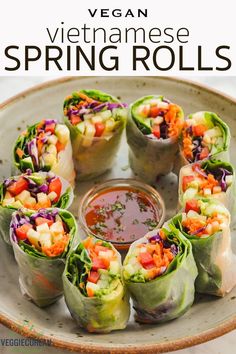 vietnamese spring rolls on a plate with dipping sauce in the middle and text overlay that reads vegan vietnamese spring rolls