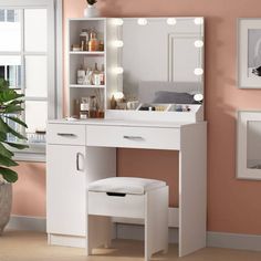 a white vanity with lights on it and a stool in front of the mirror that is open