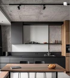 a modern kitchen with black and white decor