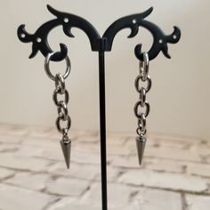 Welcome to my store! Stainless steel earrings. 📌100% stainless steel 📌Channel 📌Rings 📌Spikes 📌Length of 2.5'' (6 cm) 🌟TO SEE MORE EARRINGS: - https://www.etsy.com/fr/shop/NosferatuCreations?section_id=29427798 - https://www.etsy.com/fr/shop/NosferatuCreations?section_id=36158968 - https://www.etsy.com/fr/shop/NosferatuCreations?section_id=39342507 🖤 ABOUT NOSFERATU CREATIONS: ➙ I do wholesale! Contact me for more details 🙂 Enter a world of deliciously dark alternative jewelry... Embrace the power of the unknown and let your inner magic shine through with Nosferatu Creations jewelry ⚡️ Handmade with love in Rhode Island, USA. 🖤 📱NOSFERATU CREATIONS SOCIAL NETWORKS: - Intagram: @nosferatucreations - TikTok: @nosferatucreations - YouTube: @nosferatucreations Thank you for visiting m Punk Metal Earrings With Spikes, Punk Metal Spiked Earrings, Edgy Metal Earrings With Spikes, Edgy Metal Spike Earrings, Edgy Silver Stainless Steel Earrings, Edgy Nickel-free Stainless Steel Earrings, Edgy Stainless Steel Pierced Earrings, Edgy Stainless Steel Single Earring, Spiked Jewelry