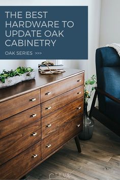 the best hardware to update oak cabinetry with oak drawers and blue upholstered chair