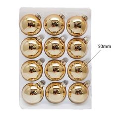 twelve gold christmas bauble ornaments on a white background with measurements for each ornament