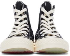 High-top canvas sneakers in black. Round rubber cap toe in off-white. Lace-up closure in off-white. Graphic and text embroidered in white and red at outer side. Eyelet vents, printed logo, and embroidered text and graphic in red and white at inner side. Rubber midsole in off-white featuring black stripes and logo patch at heel. Transparent treaded rubber outsole with red graphic. Silver-tone hardware. Supplier color: Black/Egret/Black Converse High Black, High Sneakers Women, Play X Converse, Black Chuck Taylors, Play Converse, Converse Logo, Black Chucks, Half Heart, Comme Des Garcons Black