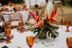 the table is set with flowers and place settings