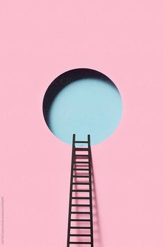 a ladder going up to the top of a pink wall