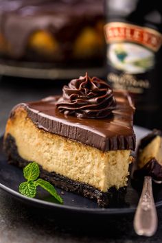 a slice of cheesecake with chocolate frosting on a plate