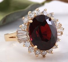 10.10 Carats Impressive Red Garnet and Natural Diamond 14K Yellow Gold Ring Suggested Replacement Value: $6,200.00 Total Natural Oval Red Garnet Weight is: Approx. 9.00 Carats Garnet Measures: Approx. 14.00 x 12.00mm Natural Round & Baguette Diamonds Weight: Approx. 1.10 Carats (color G-H / Clarity SI1-SI2) Ring total weight: Approx. 6.0 grams Disclaimer: all weights, measurements and colors are approximate and may vary slightly from the listed dimensions or as seen in the image. All picture Luxury Red Diamond Ring With Polished Finish, Luxury Lab-created Ruby Diamond Ring For Formal Occasions, Red Diamond Ring For Formal Occasions, Formal Red Diamond Ring With Polished Finish, Luxury Red Ruby Ring For Formal Occasions, Fine Jewelry Red Diamond Ring Stamped 14k, Luxury Red Ruby Ring For Anniversary, Luxury Red 14k Gold Ring, Red 14k Gold Brilliant Cut Diamond Ring