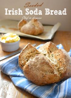 two loaves of irish soda bread on a blue and white towel