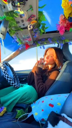 a woman sitting in the back seat of a car