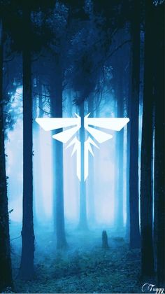 a white firefly logo is in the middle of a forest with fog and trees