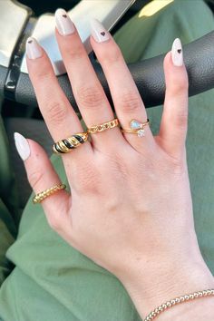 From chunky gold bands to dazzling gemstone accents, these rings are perfect for adding some personality and flair to any outfit. This ring stack is a source of inspiration for anyone looking to make a statement with their jewelry. Grab your favorite statements at littleskystone.com! ✨ Ring Collections