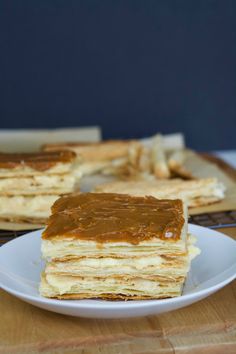 there is a plate with pancakes on it and peanut butter in the middle next to them