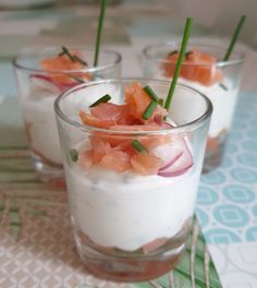 small glasses filled with food on top of a table