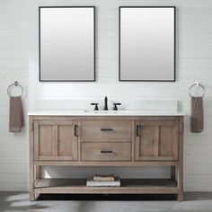 two mirrors are above the double sink vanity in this white tiled bathroom with wood accents