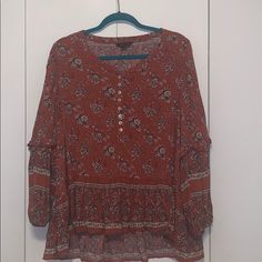 Brand: American Eagle Size: Xl Detail: Burnt Orange Floral High-Low Blouse (Buttons Come Undone At Top) ** Brand New Without Tags ** Casual Long Sleeve Blouse With Boho Print, Casual Long Sleeve Boho Print Blouse, Casual Boho Print Tunic Top, Casual Patterned Peasant Top For Fall, Casual Flowy Boho Print Blouse, Flowy Boho Print Casual Blouse, Printed Tunic Blouse For Fall, Casual Floral Print Tunic Top, Casual Patterned Flowy Peasant Top