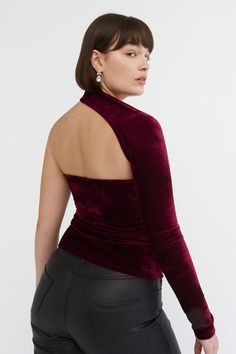 FINAL SALE - NO RETURNS, EXCHANGES, OR STORE CREDIT Sophisticated meets oh-so-soft. Handcrafted from sumptuous velvet jersey, our Manhattan Velvet One Shoulder Top feels like a hug. She's designed with our iconic wrap-around neckline and elongated bodice for a look that's sleek and any occasion-friendly. Easy to style, she'll quickly become your best friend for nights out.[SPLIT] Natalee, in crimson, is 5'10" (178 cm) tall, wearing size M. Sam, in black, is 5'8" (173 cm) tall, wearing size XS. A Velvet Tops For Winter Night Out, Chic Velvet Tops For Winter, Fall Evening Velvet Tops, Velvet Stretch Top For Party, Velvet Tops For Fall Night Out, Chic Velvet Evening Top, Chic Velvet Top For Evening, Velvet Stretch Tops For Night Out, Chic Velvet Party Tops