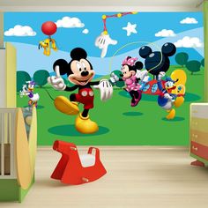 mickey mouse wall mural in a child's room with other disney characters flying around