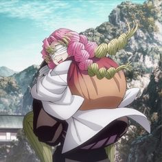 an anime character with pink hair and green eyes holding a large object in her hands