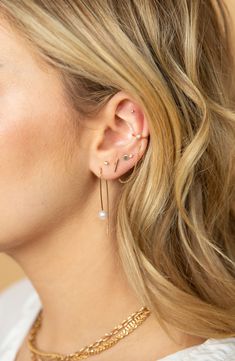 A thread-through design gives a sleek silhouette to 14-karat-gold earrings that are anchored with freshwater pearls. 1 1/8" drop; 1/4" width Pearl size: 7mm Thread-through style Pearl size: 5.5–6mm 14k gold/freshwater pearl Made in the USA Pearl Threader Earrings, Zoe Chicco, Threader Earrings, Pearl Size, Fresh Water, Freshwater Pearls, Gold Earrings, Thread, Sleek