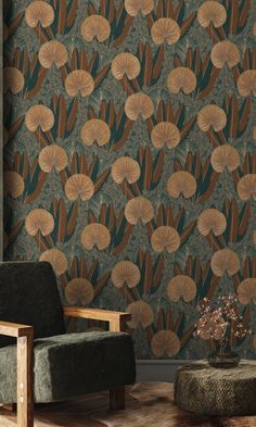 a chair and ottoman in front of a wallpapered with fan shaped leaves on it