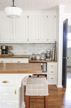 the kitchen is clean and ready for us to use it's counters are white