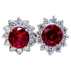 GIA Certified Lab Created Ruby Earrings Totaling: 3.09ct X 3.20ct Oval Cut, Clean clarity and brilliant cut Excellent transparency 8.9 x 8.5mm & 9.05 x 8.6mm 2ct. Natural Round diamonds G-color, Vs-2 clarity 14kt. yellow gold 7.9 grams Earrings overall: .64 x .57 inch Comfortable Butterfly Backs $11000 appraisal will accompany Emerald Diamond Earrings, Diamond Cluster Earrings, White Gold Earrings Studs, White Gold Studs, Ruby Earrings, Ruby Jewelry, Topaz Earrings, Brown Diamond, Ruby Diamond