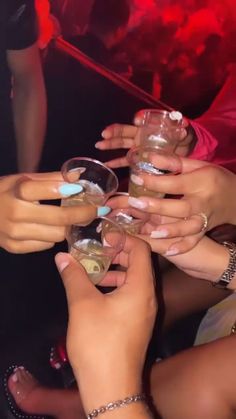 several people are toasting with wine glasses