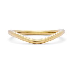 a yellow gold ring with curved edges