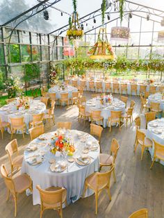 an outdoor venue with tables and chairs set up for a formal function in the sun