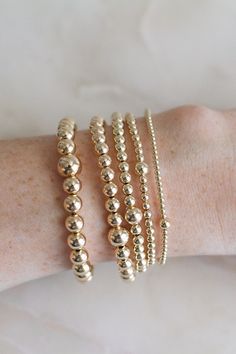 ❖MYLA BRACELET❖ *The all day-everyday-stackable bracelet!  ‣Our Myla Bracelets Feature:  *14k-Gold Filled Beads (high-quality, water + tarnish resistant, perfect for everyday wear!) *Available in 5 sizes: 2mm, 3mm, 4mm, 5mm, 6mm *Single larger bead (2mm + 6mm, 3mm + 5mm, 4mm + 6mm, 5mm + 7mm, 6mm + 8mm) *Tight/Sturdy elastic, pre-stretched to prevent bracelet from stretching out ‣Sizing Tips:  Please measure your wrist for the best fit!  *Using a soft tape measure/string, measure around your wrist, above the wrist bone *Add length according to your desired fit:       * 0" - fitted, snug      * .25" - slight movement      * .5" -  comfortable movement      * .75"- loose      * 1" - extra loose *Please message us if you need any help with sizing!  ------- ‣Each bracelet is made to order ‣We Minimalist Yellow Gold Stretch Bracelet For Everyday, Minimalist Stretch Bracelet With Round Beads For Everyday, Minimalist Stretch Bracelet With Round Beads, Minimalist Everyday Stretch Bracelet With Round Beads, Dainty Yellow Gold Stretch Bracelet For Everyday, Dainty Hypoallergenic Stretch Bracelet For Everyday, Minimalist Yellow Gold Stretch Bracelet, Stackable Yellow Gold Beaded Bracelets For Everyday, Minimalist Stackable Stretch Bracelet For Everyday