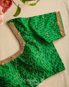 "❤️❤️ Give a New Look to all your Old Silk Sarees ❤️❤️ For the First time ever, we're bringing only blouses to our Patrons as we have a Huge requests for our Blouses. Green Ikkat Sico blouse with zardosi embroidery over the blouse with regular U shaped back neck. All the blouses are true to its size and fits absolutely well. The fit, stitching and shape makes all the difference as these are custom sewn and Hand Embroidered. MEASUREMENTS: Sleeve Size: 10 Inch Size : 38-44\" Blouse Length: 15 inch Green Blouse For Eid Reception, Reception Blouse Piece With Motifs For Navratri, Navratri Reception Blouse Piece With Motifs, Green Cutdana Blouse For Eid, Cutdana Blouse For Reception During Navratri, Green Tops For Reception And Festivals, Designer Transitional Blouse With Motifs, Festive Silk Tops With Motifs, Green Self-design Blouse For Eid