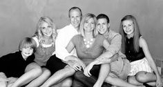 a family poses for a black and white photo